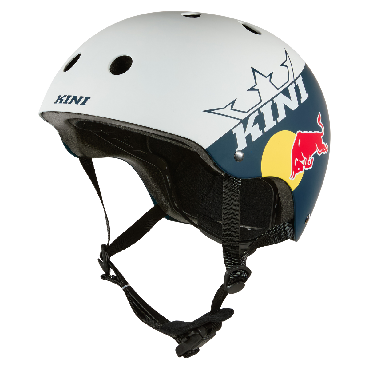 Der KINI RED BULL BB Helm 1.0 von Kini Red Bull ist ein weißer und marineblauer Motorradhelm mit Belüftungslöchern, schwarzem Kinnriemen, Kronengrafik, gelbem Kreis und "KINI" & Red Bull Logos - eine zuverlässige Sicherheitsausrüstung für Motorradfahrer.