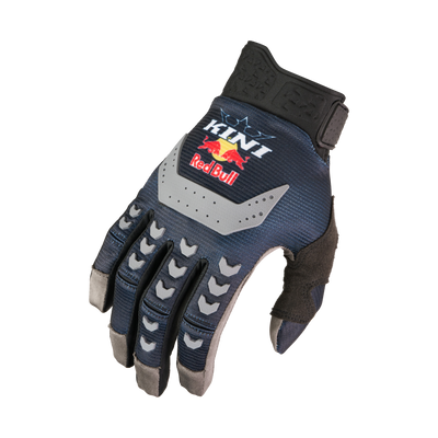 Der KINI RED BULL MXC Handschuh 1.0 von Kini Red Bull ist ein dunkelblauer und schwarzer Motocross-Handschuh mit grauen Akzenten, der mit dem Kini- und dem Red Bull-Logo für Schutz und Grip sorgt.
