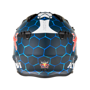 Der KINI RED BULL XDR 1.0 Helm von Mission Kini ist ein blauer Motorradhelm mit einem sechseckigen Muster, Red Bull Logos auf beiden Seiten, "KTM" auf der Rückseite und schwarzen Belüftungsöffnungen oben und in der Mitte.